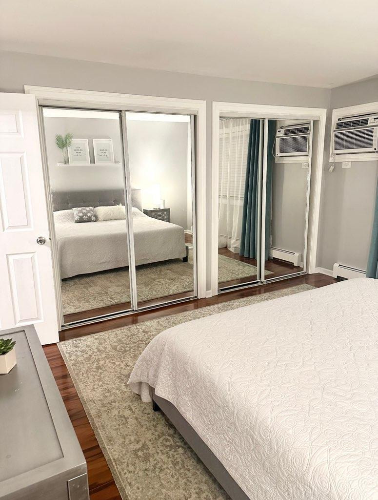 491 McHenry Road, Unit 3A Wheeling, IL 60090 - Photo 11 of 17 a bedroom with a bed and a large window