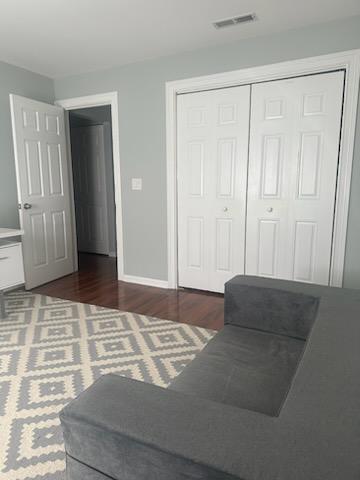 491 McHenry Road, Unit 3A Wheeling, IL 60090 - Photo 12 of 17 a bedroom with a bed and a couch