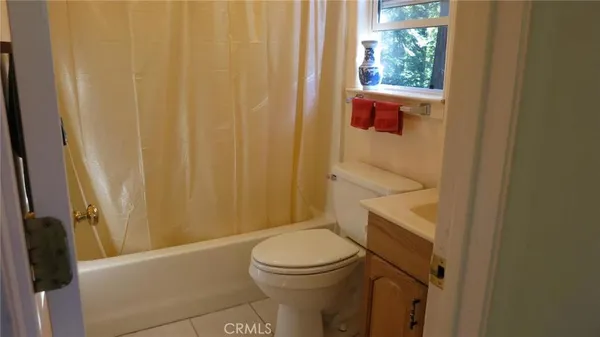 a view of a bathroom with a sink and mirror