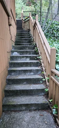 a view of a balcony with wooden floor