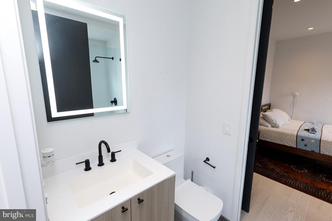 1321 Monroe Street Northwest, Unit PH Washington, DC 20010 - Photo 14 of 40 a bathroom with a sink and a mirror