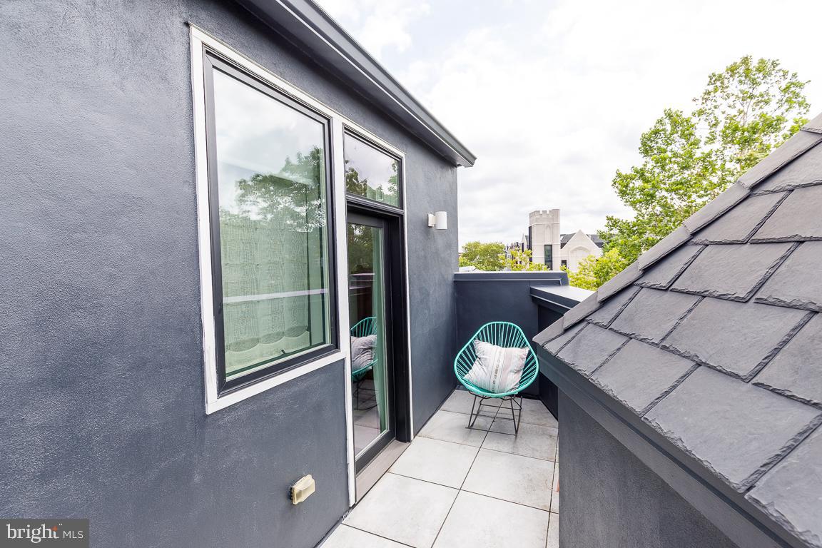 1321 Monroe Street Northwest, Unit PH Washington, DC 20010 - Photo 32 of 40 a view of a porch with furniture
