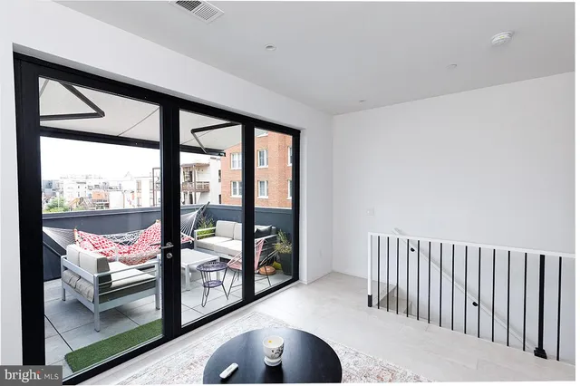a view of a hallway with washer and dryer
