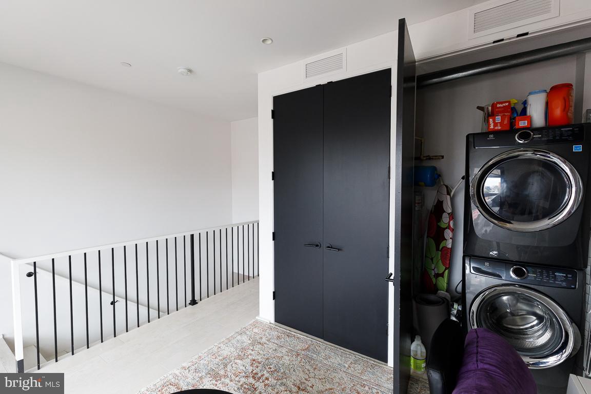 1321 Monroe Street Northwest, Unit PH Washington, DC 20010 - Photo 36 of 40 a view of a hallway with washer and dryer