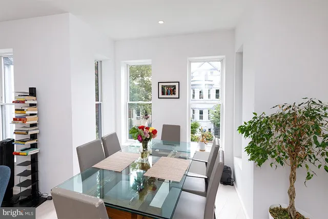 a view of a dining room with furniture window and flowerpot