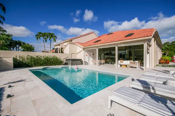 a view of swimming pool with outdoor seating and yard