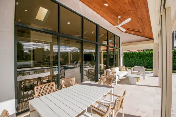 an aerial view of a house with a garden and trees