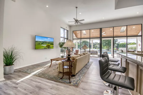 a living room with furniture and a large window