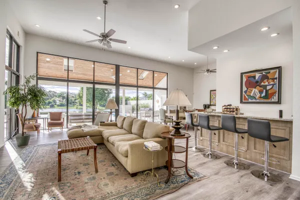 a living room with furniture and a potted plant