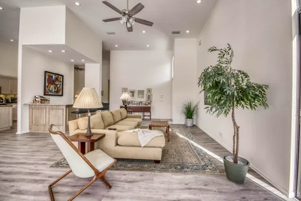 a living room with furniture and a large window