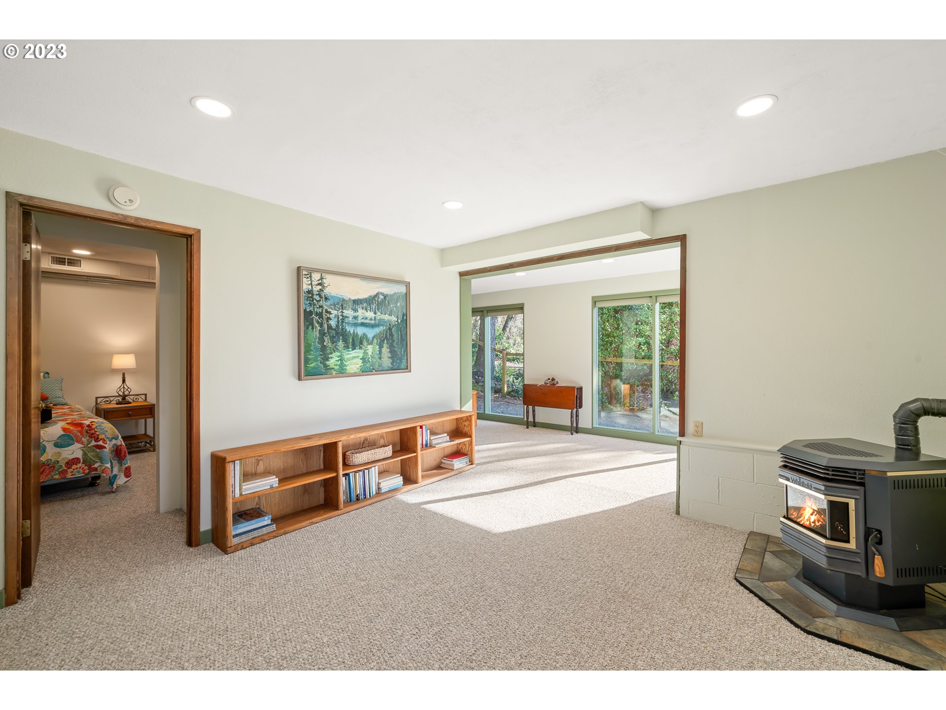 38475 Beulah Reed Road Nehalem, OR 97131 - Photo 20 of 31 a bedroom with furniture and a large window