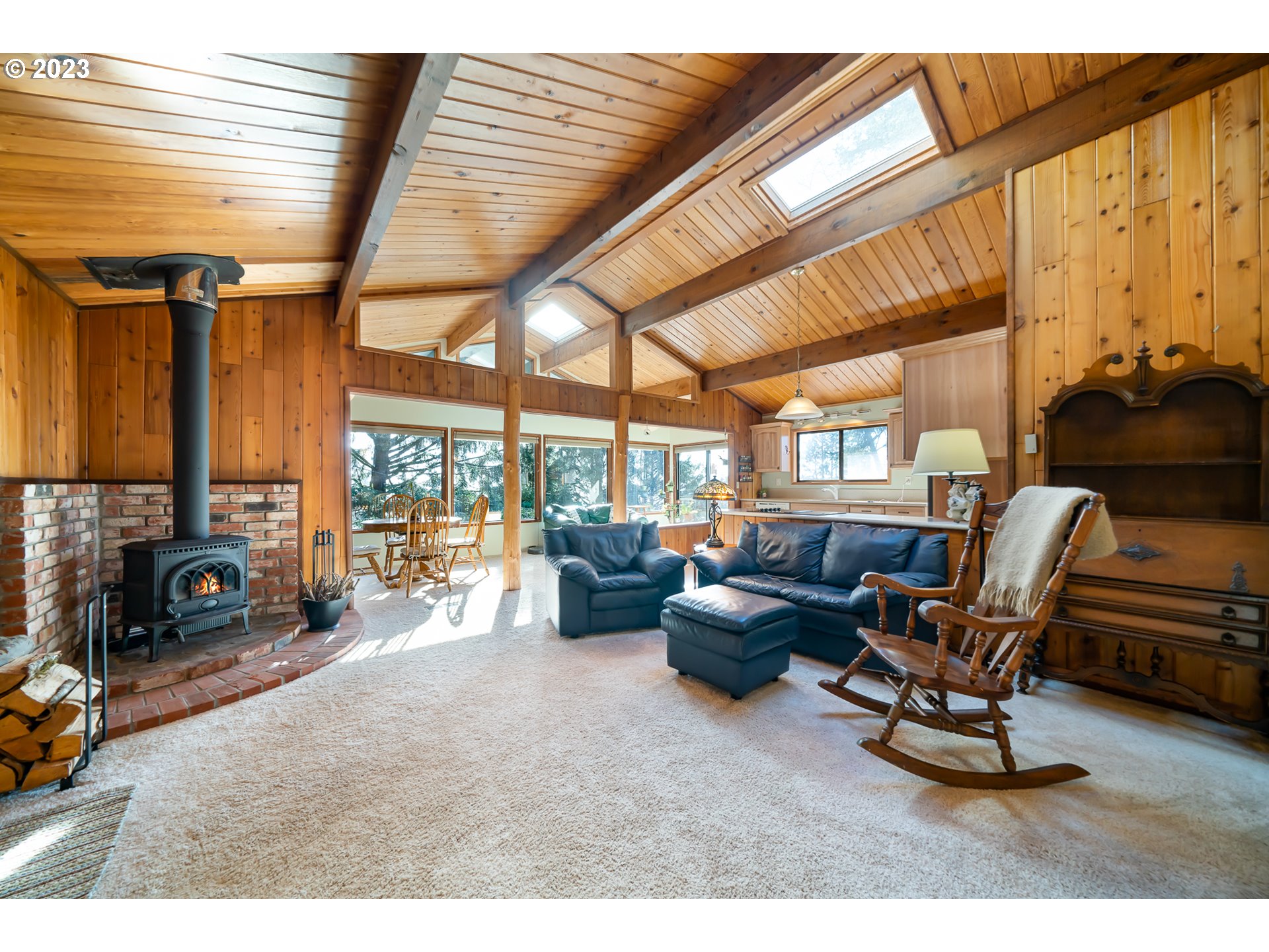38475 Beulah Reed Road Nehalem, OR 97131 - Photo 4 of 31 a living room with furniture and a fireplace