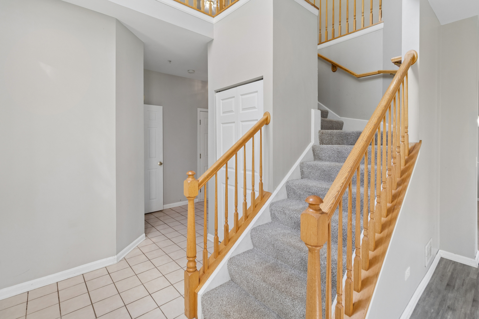 2075 Ivy Ridge Drive Hoffman Estates, IL 60192 - Photo 11 of 20 a view of staircase with wooden floor and stairs