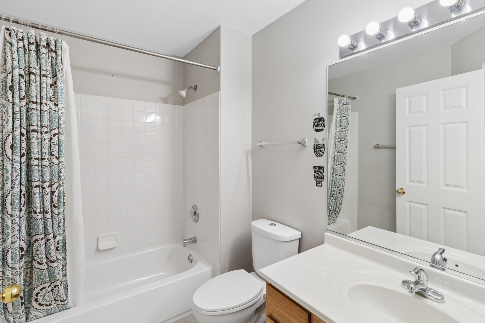2075 Ivy Ridge Drive Hoffman Estates, IL 60192 - Photo 15 of 20 a bathroom with a sink toilet and shower