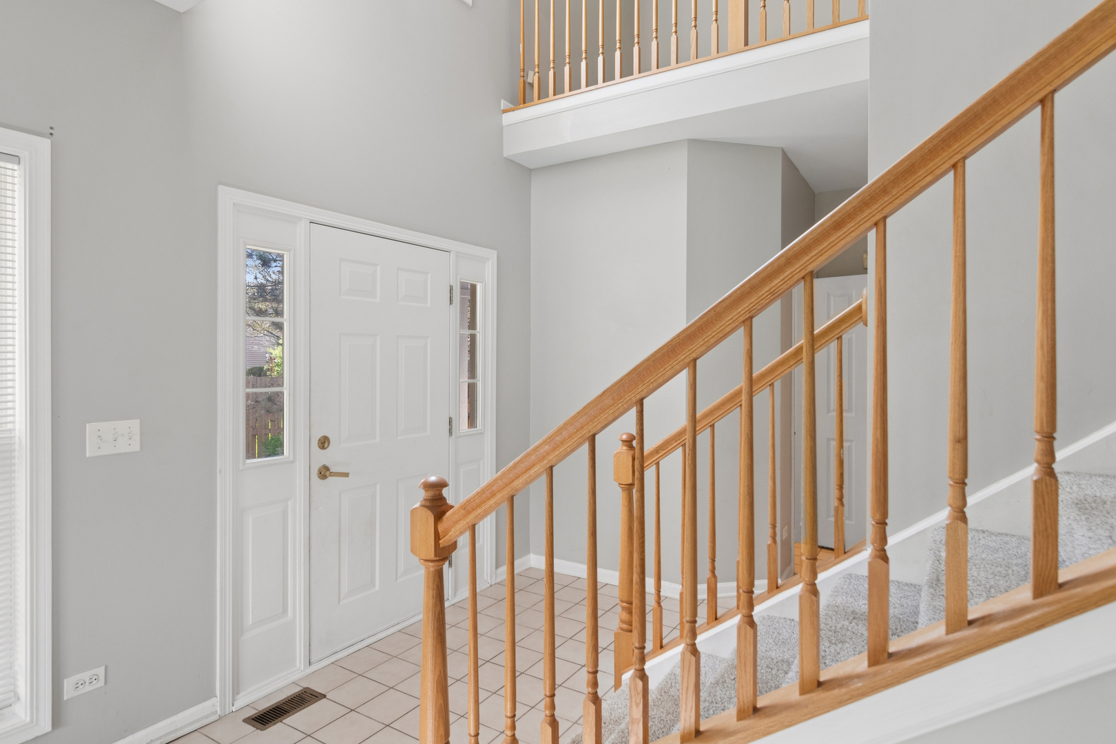 2075 Ivy Ridge Drive Hoffman Estates, IL 60192 - Photo 2 of 20 a view of staircase with railing and white walls