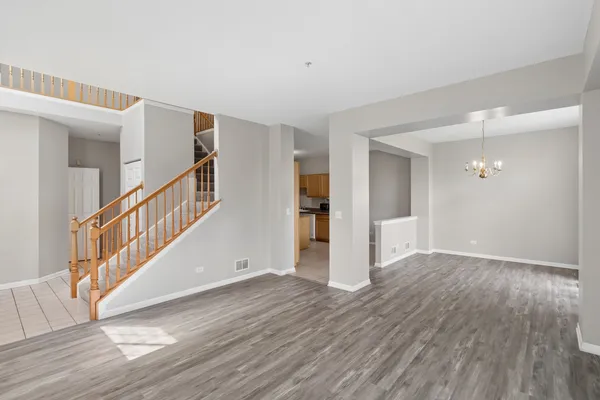 a view of an entryway with wooden floor