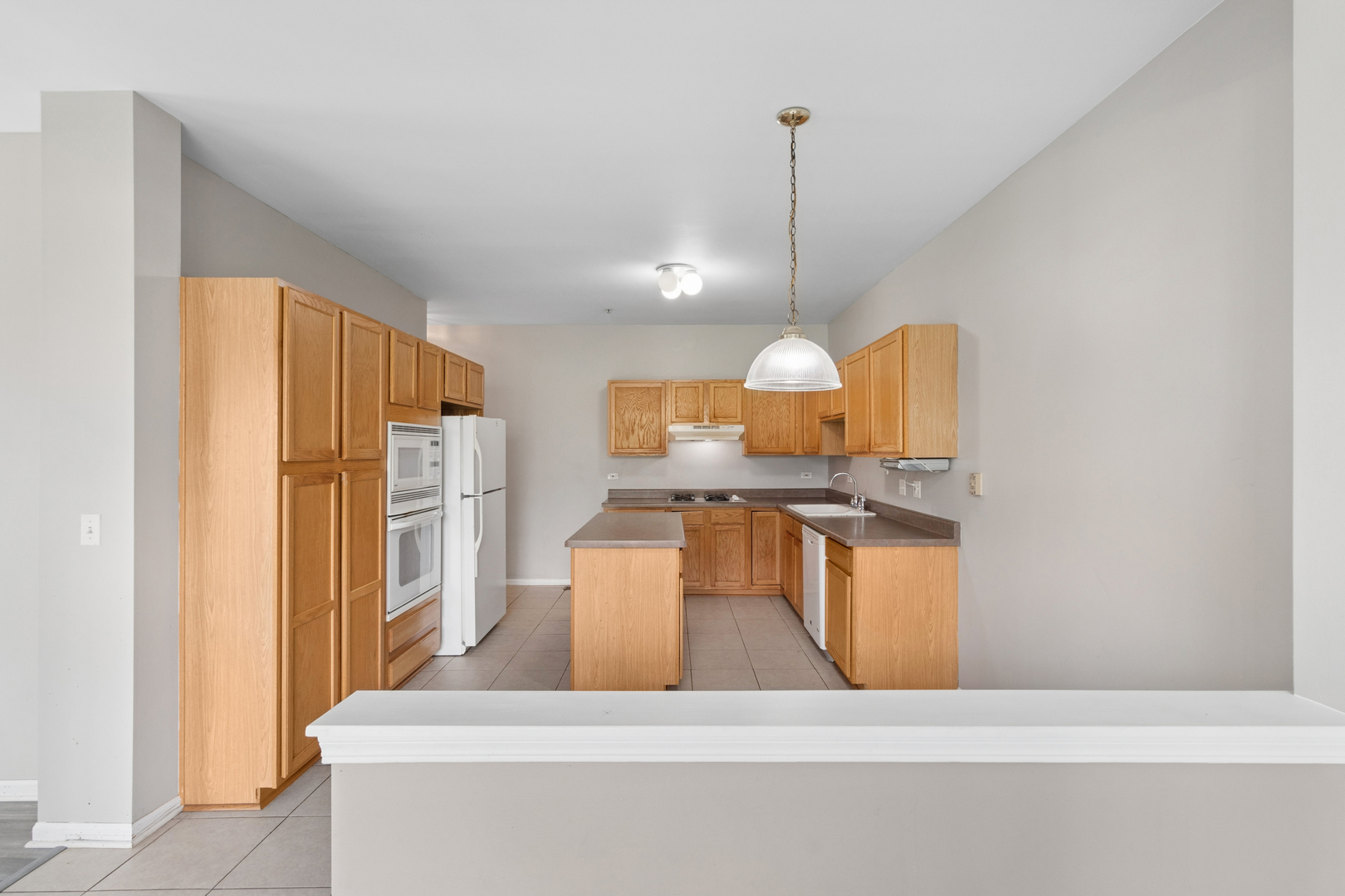 2075 Ivy Ridge Drive Hoffman Estates, IL 60192 - Photo 6 of 20 a kitchen with stainless steel appliances granite countertop a sink a stove and a refrigerator