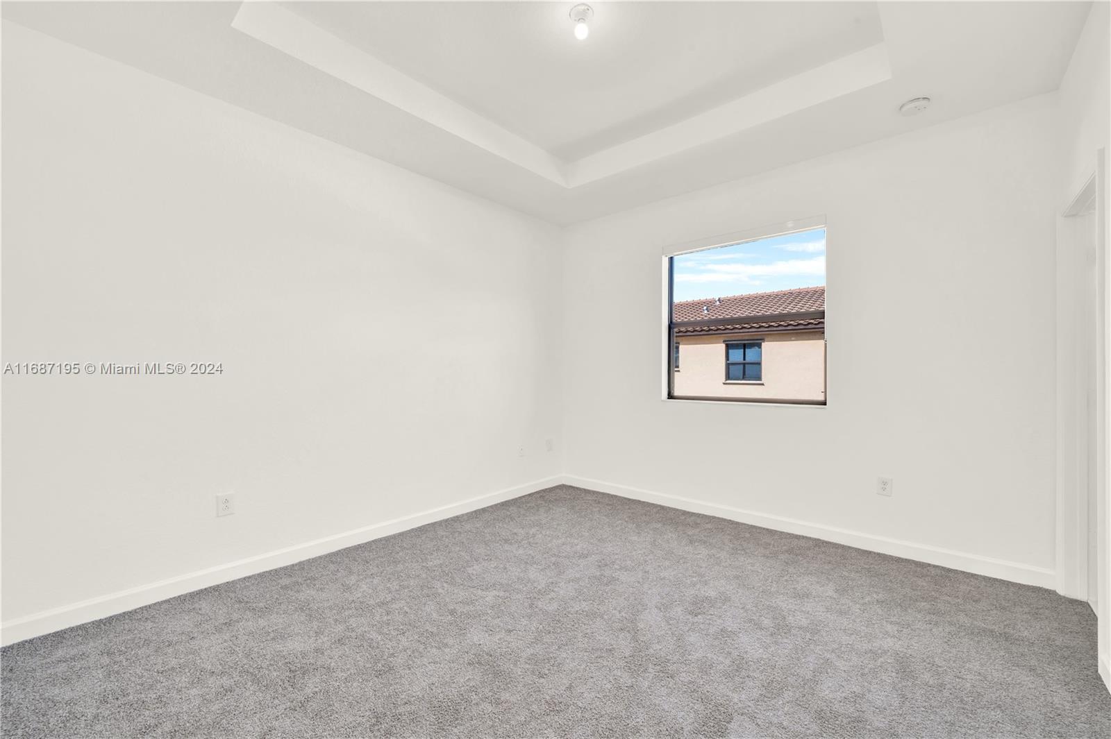 11343 Southwest 250th Terrace, Unit 11343 Homestead, FL 33032 - Photo 17 of 37 an empty room with a entryway