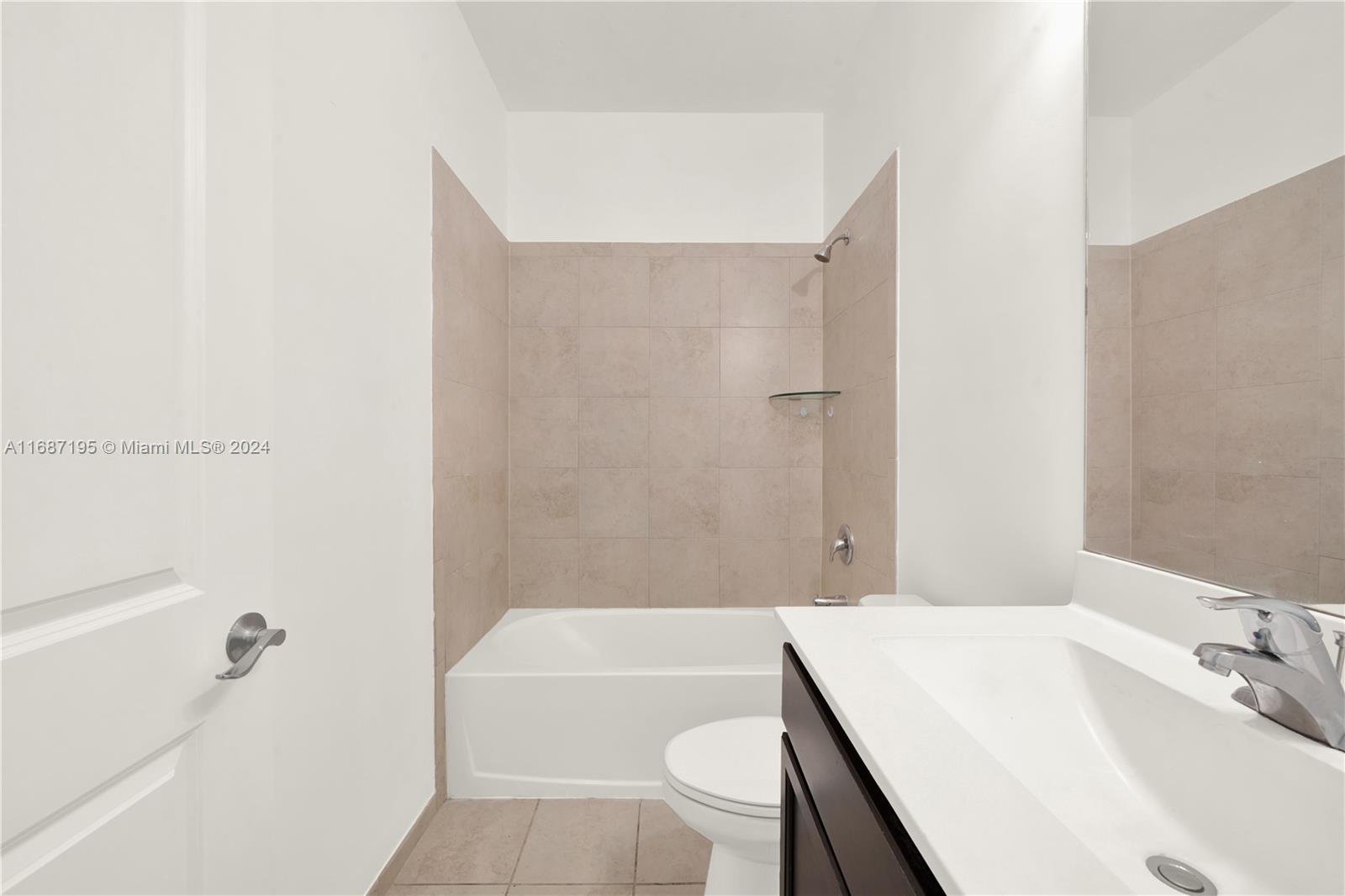 11343 Southwest 250th Terrace, Unit 11343 Homestead, FL 33032 - Photo 23 of 37 a bathroom with a sink a toilet and bathtub