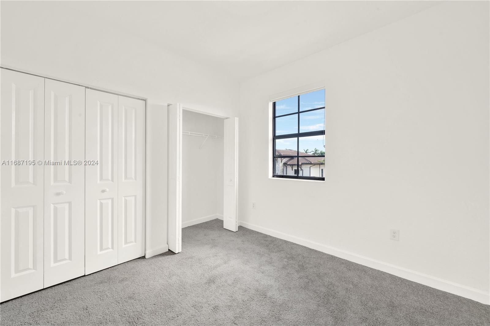 11343 Southwest 250th Terrace, Unit 11343 Homestead, FL 33032 - Photo 24 of 37 an empty room with windows