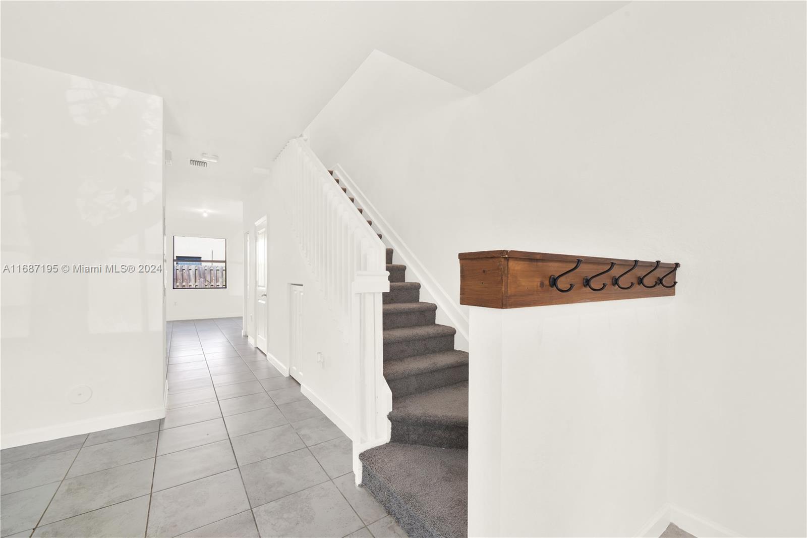 11343 Southwest 250th Terrace, Unit 11343 Homestead, FL 33032 - Photo 3 of 37 a view of entryway and hall