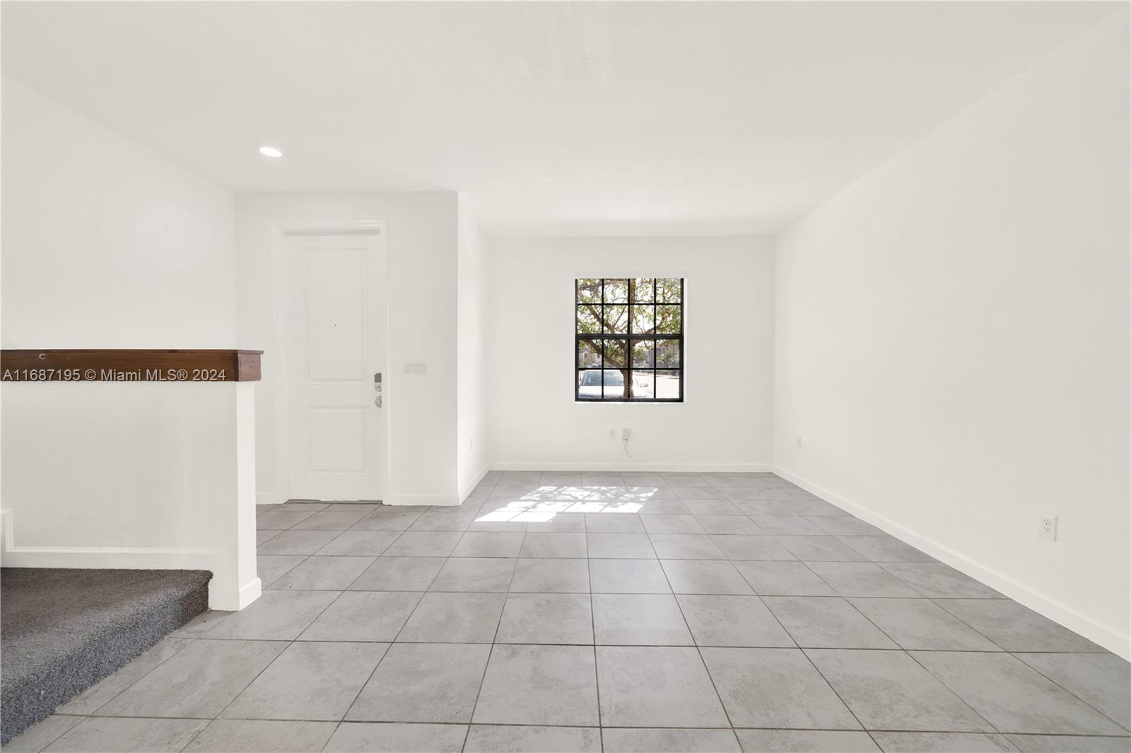 11343 Southwest 250th Terrace, Unit 11343 Homestead, FL 33032 - Photo 6 of 37 an empty room with windows and closet