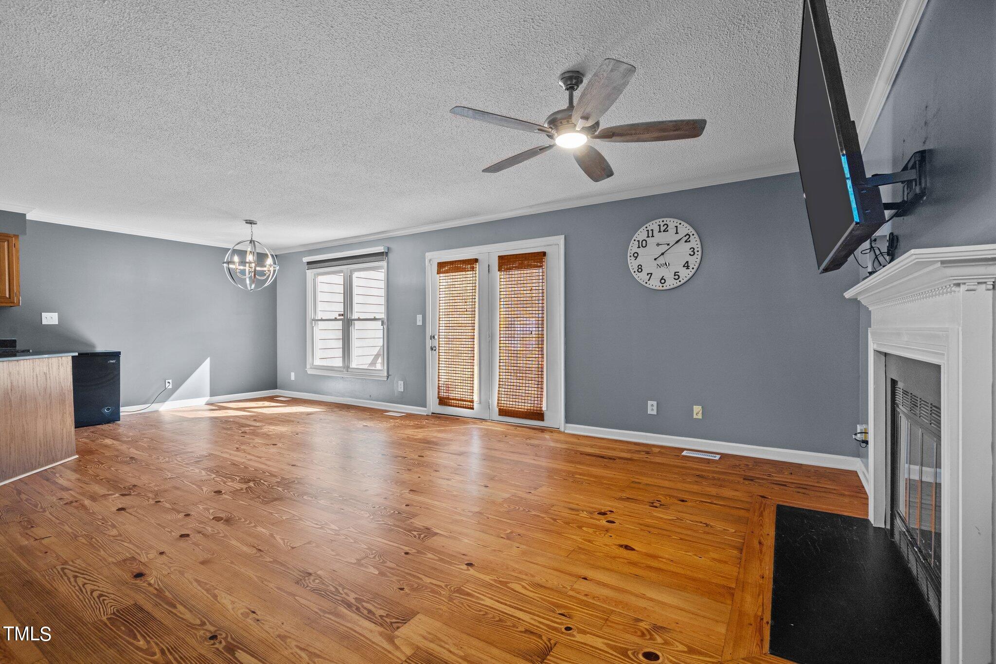 3520 Rawdon Drive Durham, NC 27713 - Photo 11 of 30 a view of an empty room with window and wooden floor