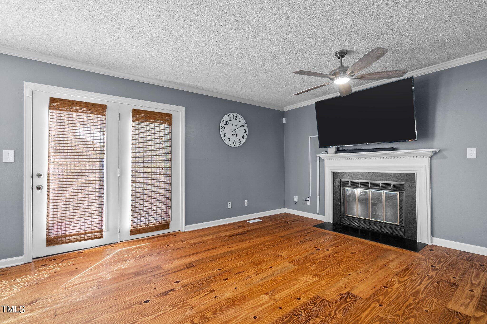3520 Rawdon Drive Durham, NC 27713 - Photo 2 of 30 a view of empty room with fireplace and tv