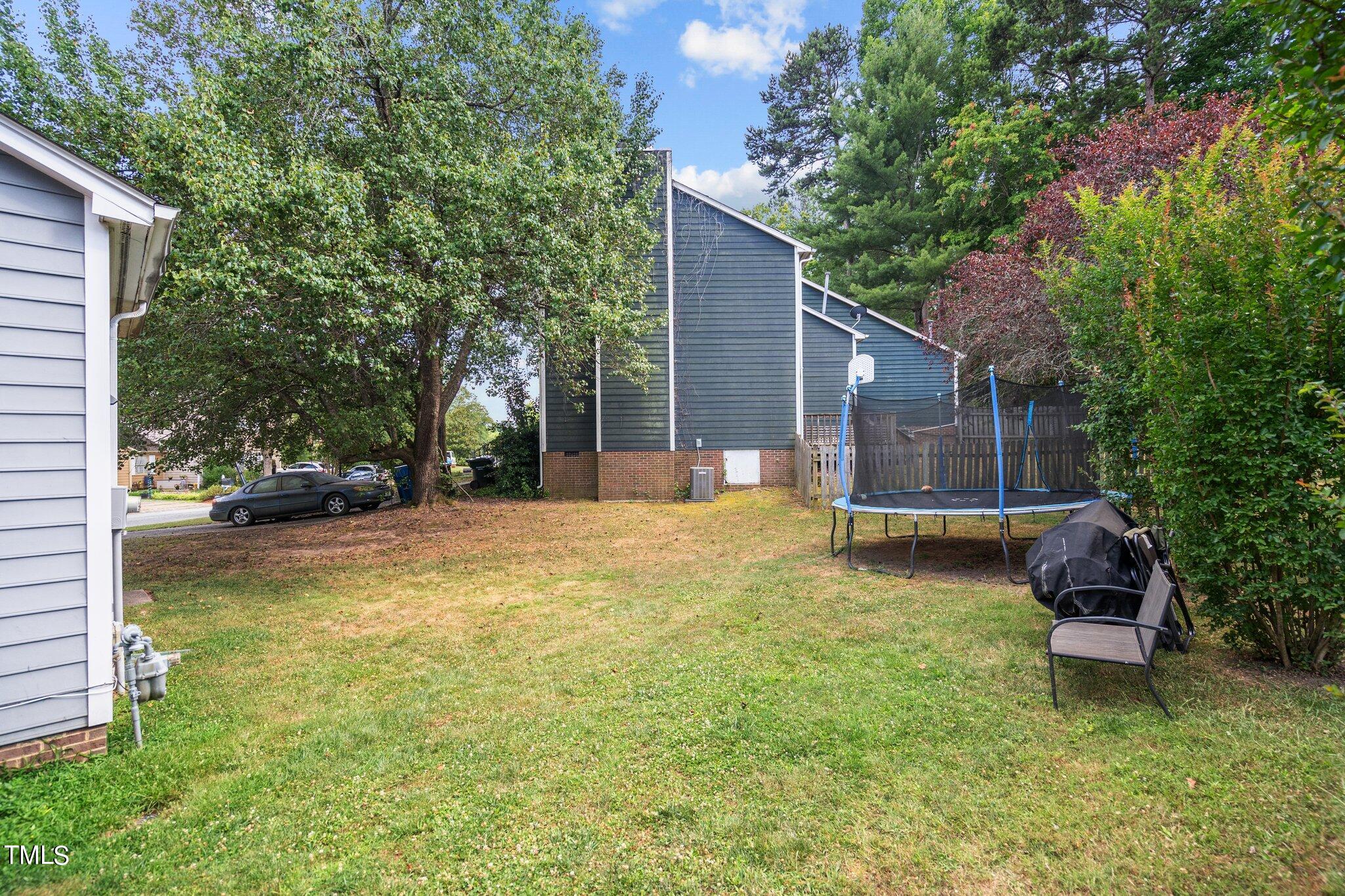 3520 Rawdon Drive Durham, NC 27713 - Photo 25 of 30 a view of swimming pool with a bench and trees