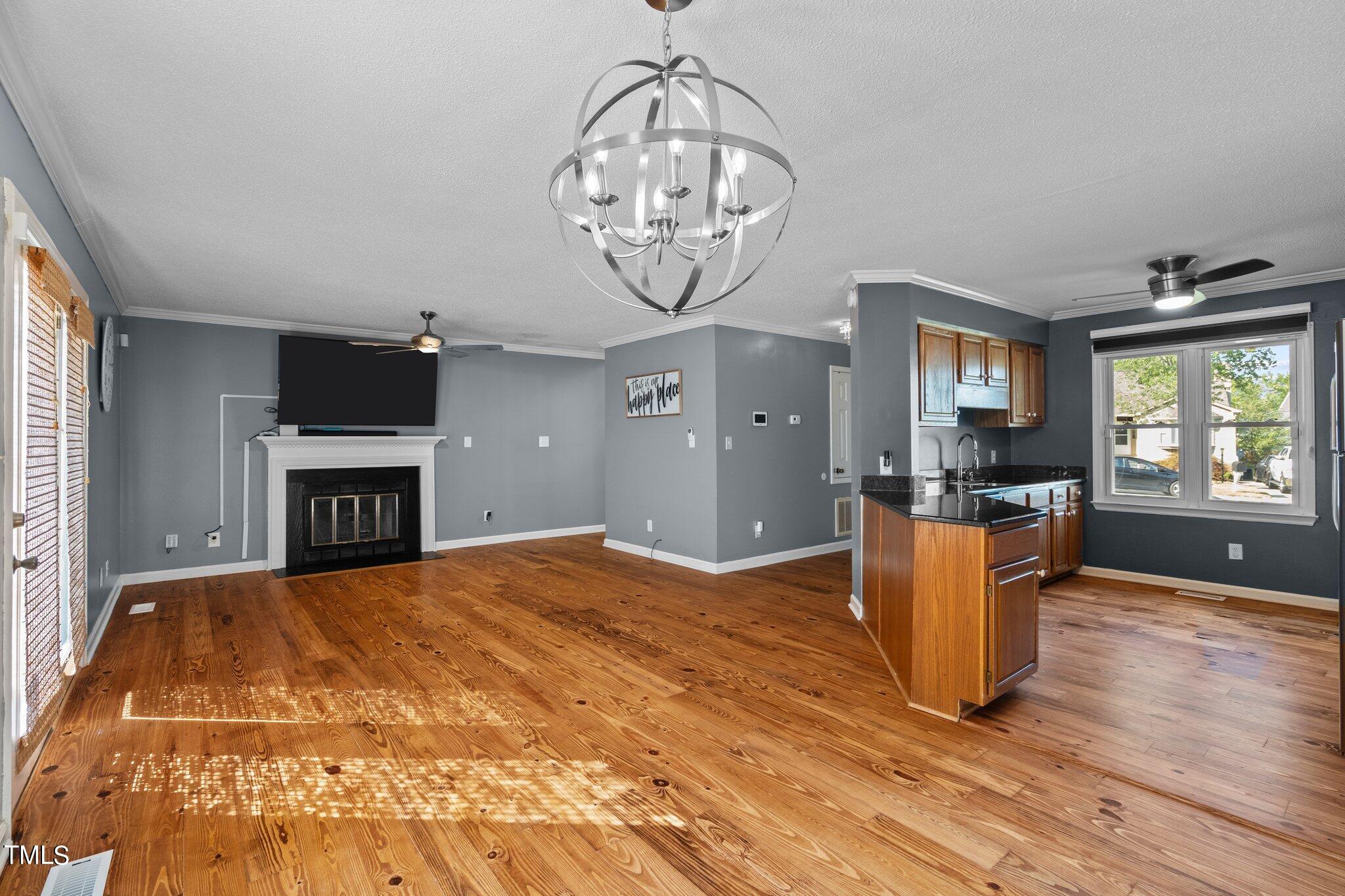 3520 Rawdon Drive Durham, NC 27713 - Photo 6 of 30 a view of empty room with a window and wooden floor