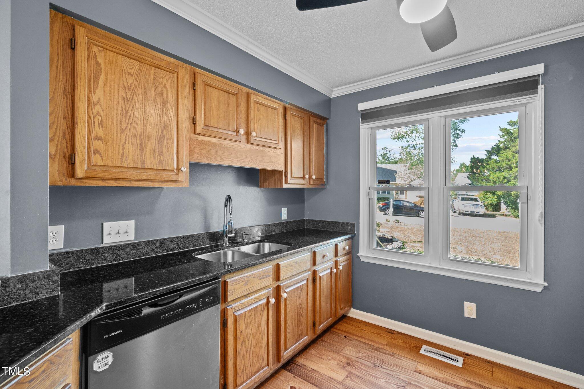 3520 Rawdon Drive Durham, NC 27713 - Photo 8 of 30 a kitchen with stainless steel appliances granite countertop a stove a sink and a microwave