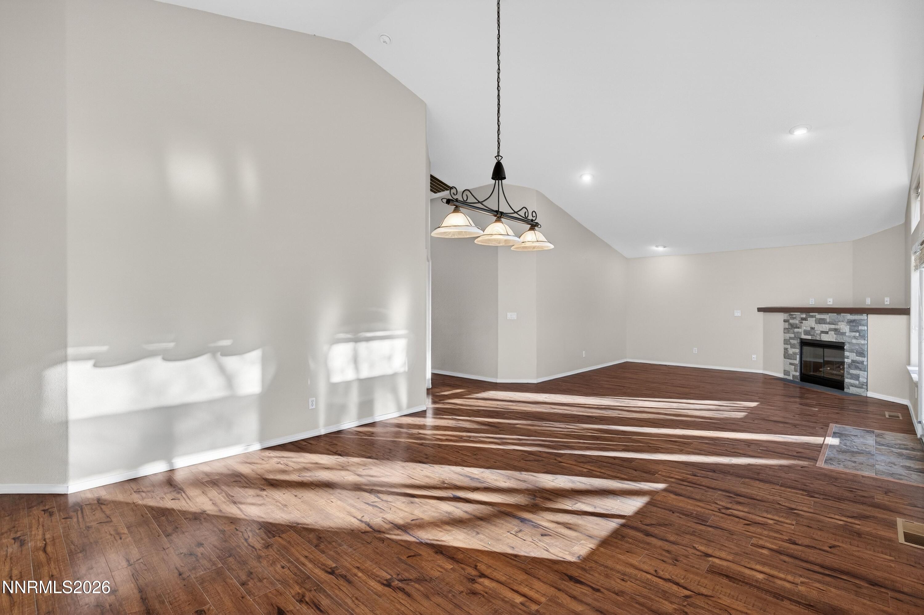 6279 Golden Meadow Road Reno, NV 89519 - Photo 18 of 57 a bedroom with a bed and a chandelier
