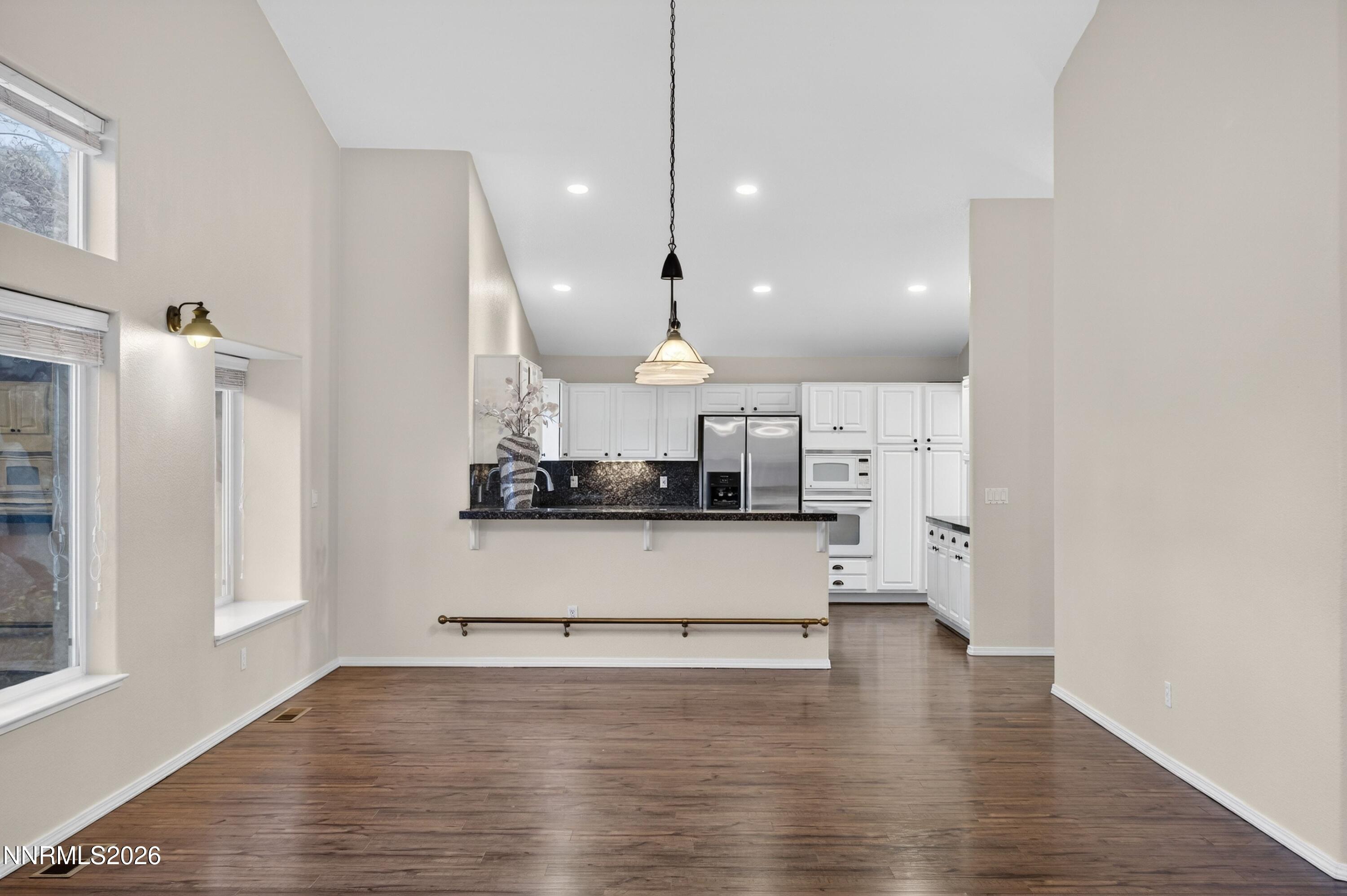 6279 Golden Meadow Road Reno, NV 89519 - Photo 24 of 57 a large kitchen with stainless steel appliances kitchen island a large counter space a sink a refrigerator and a window