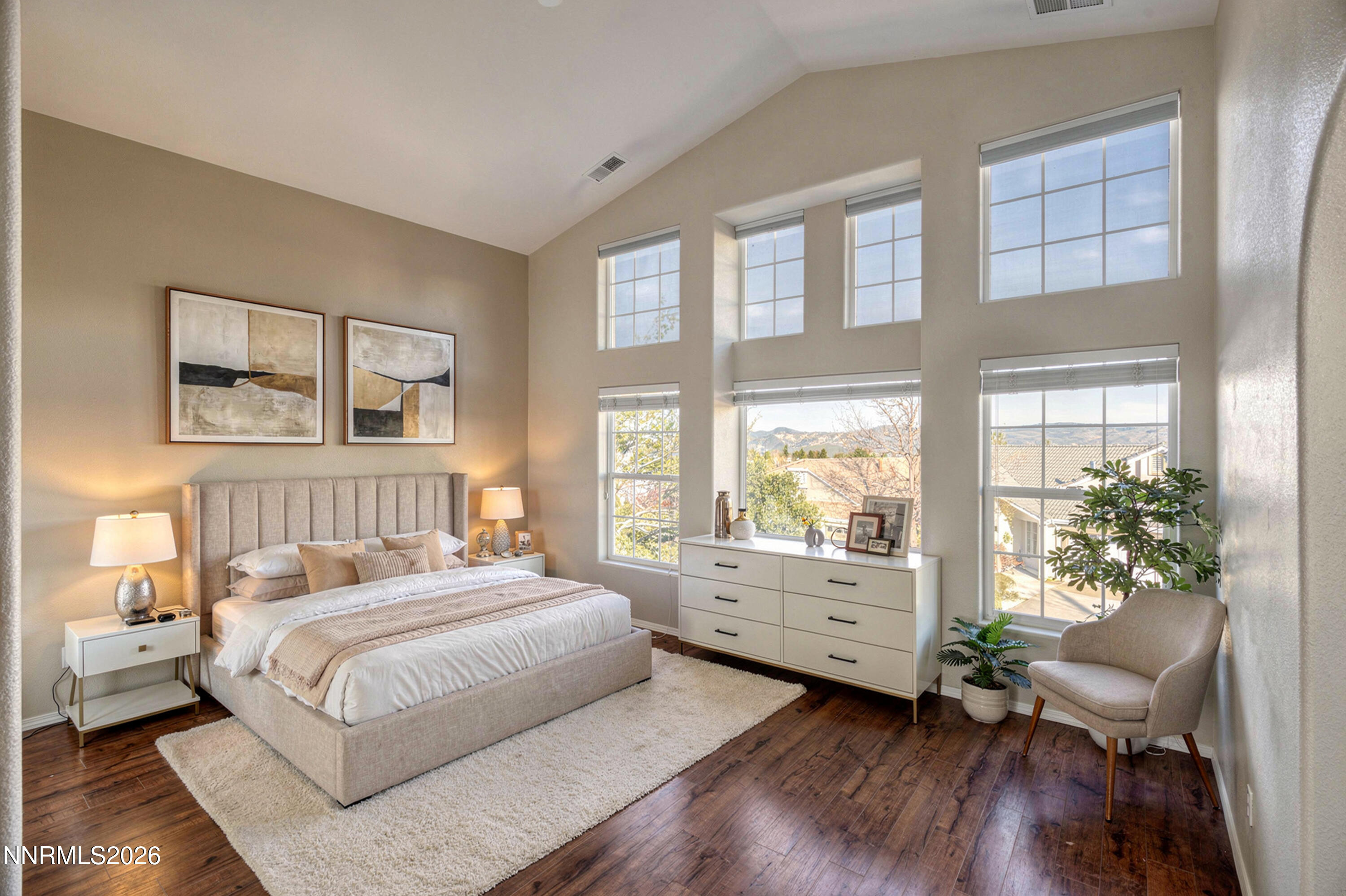 6279 Golden Meadow Road Reno, NV 89519 - Photo 28 of 57 a bedroom with a large bed and a large window