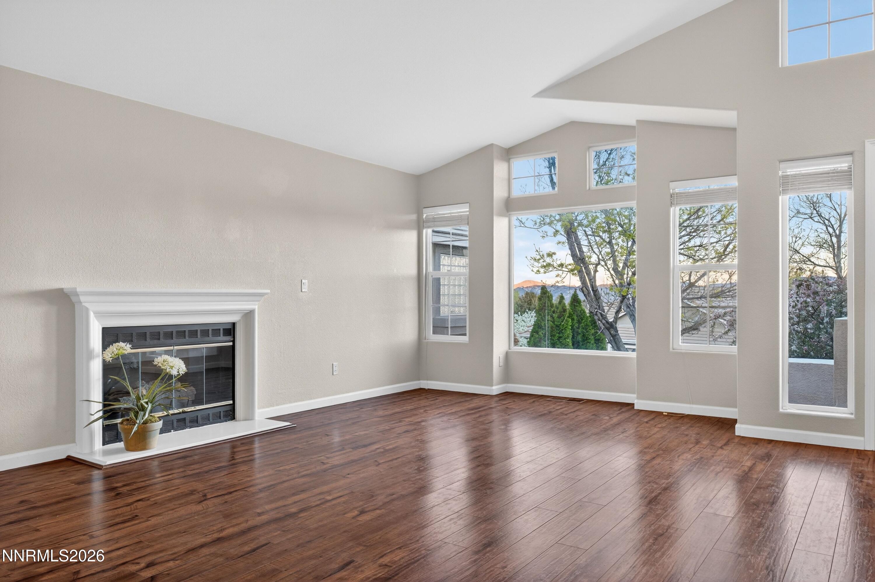 6279 Golden Meadow Road Reno, NV 89519 - Photo 4 of 57 a view of an empty room with wooden floor and a window