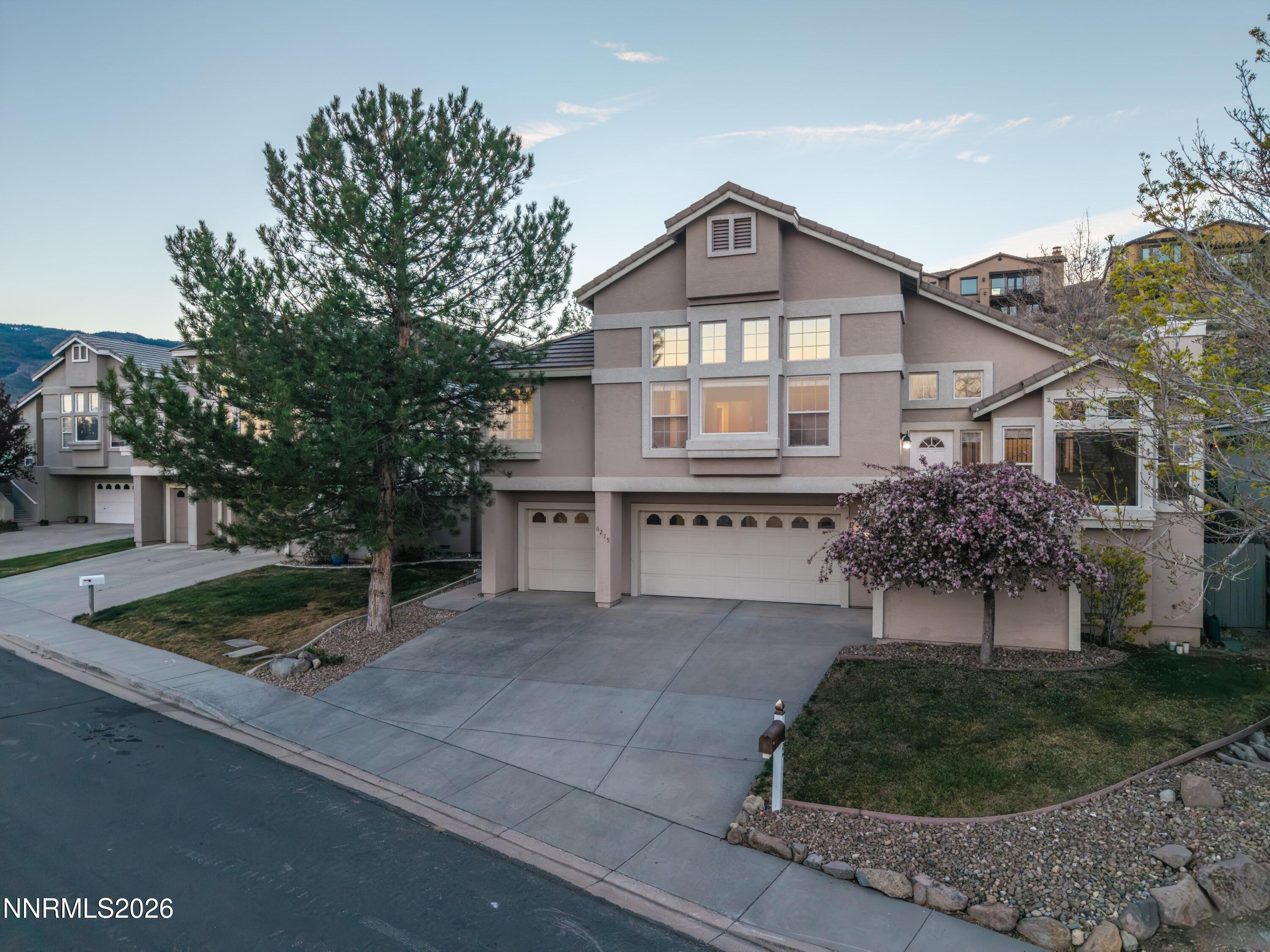 6279 Golden Meadow Road Reno, NV 89519 - Photo 54 of 57 a front view of a house with a yard