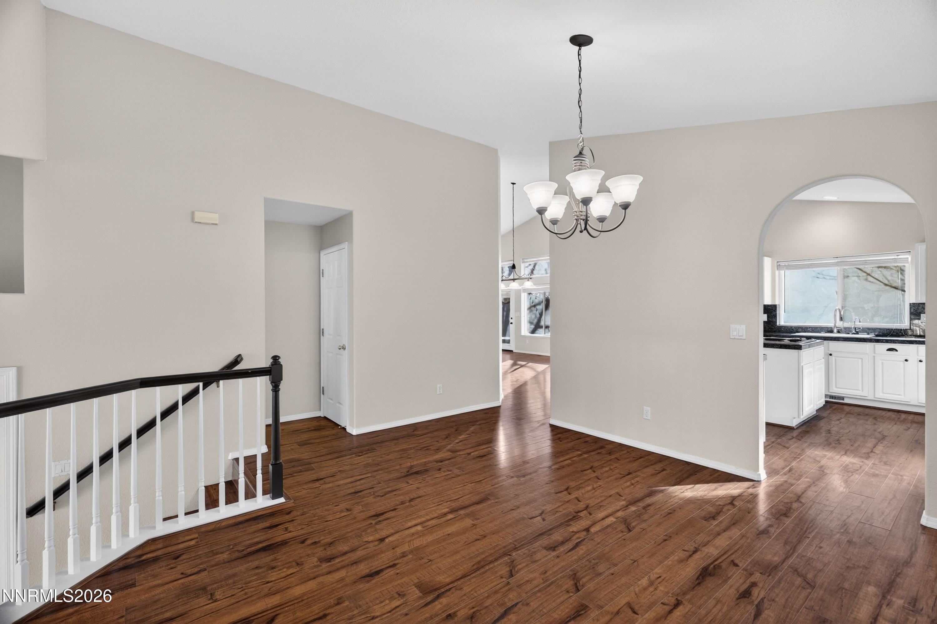 6279 Golden Meadow Road Reno, NV 89519 - Photo 8 of 57 a view of a room with wooden floor and staircase