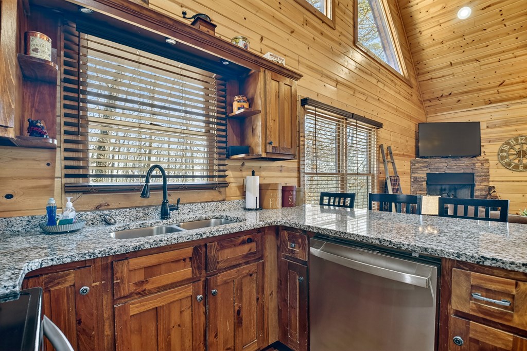 78 Brass Hill Road Blue Ridge, GA 30513 - Photo 16 of 44 a kitchen with granite countertop a sink and a window