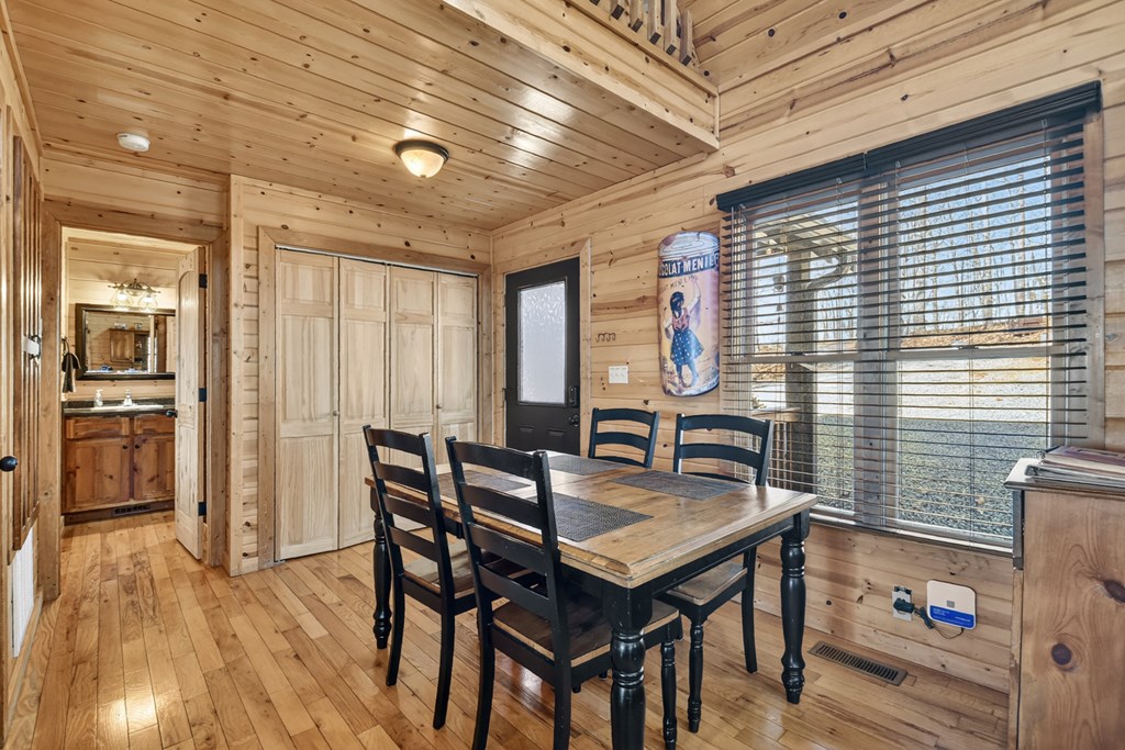 78 Brass Hill Road Blue Ridge, GA 30513 - Photo 18 of 44 a view of a dining room with furniture and wooden floor