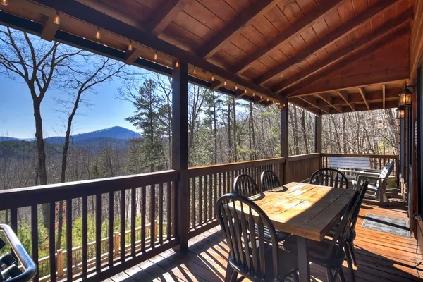 a view of a balcony with furniture