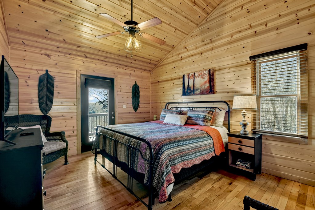 78 Brass Hill Road Blue Ridge, GA 30513 - Photo 29 of 44 a bedroom with a bed and wooden floor