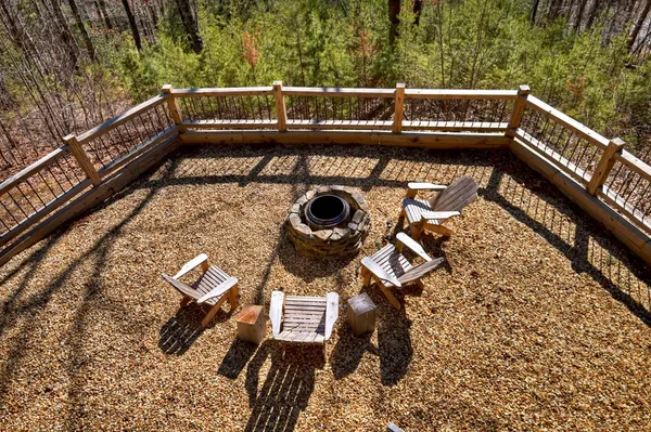 a view of deck with wooden floor and outdoor seating