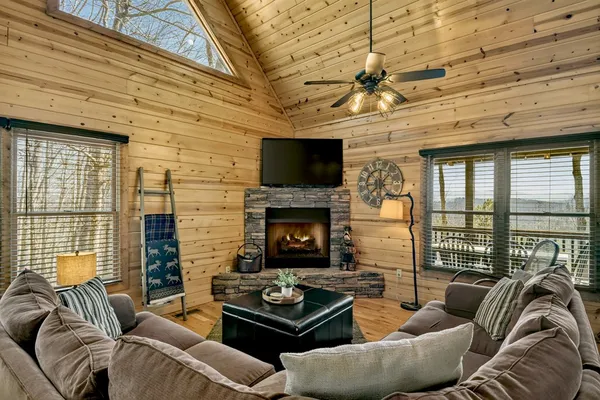 a living room with furniture fireplace and a flat screen tv