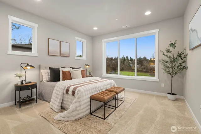 a spacious bedroom with a bed and a window