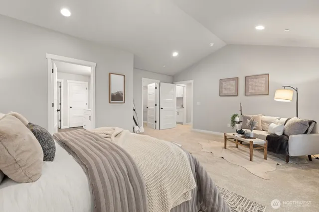 a spacious bedroom with a bed and furniture