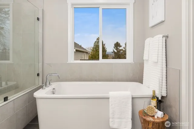 a bathroom with a tub and a sink