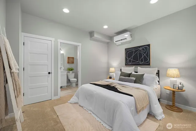 a bedroom with a bed and a painting