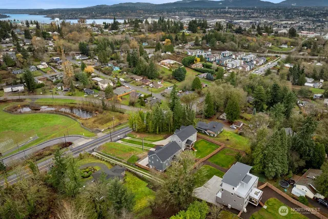 an aerial view of residential houses with outdoor space