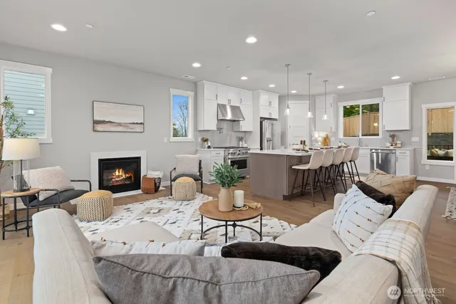 a living room with furniture or fireplace and a table