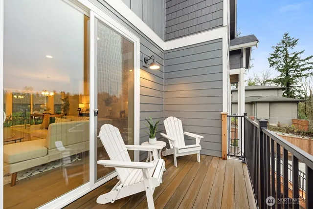 a view of a balcony with two chairs and a table